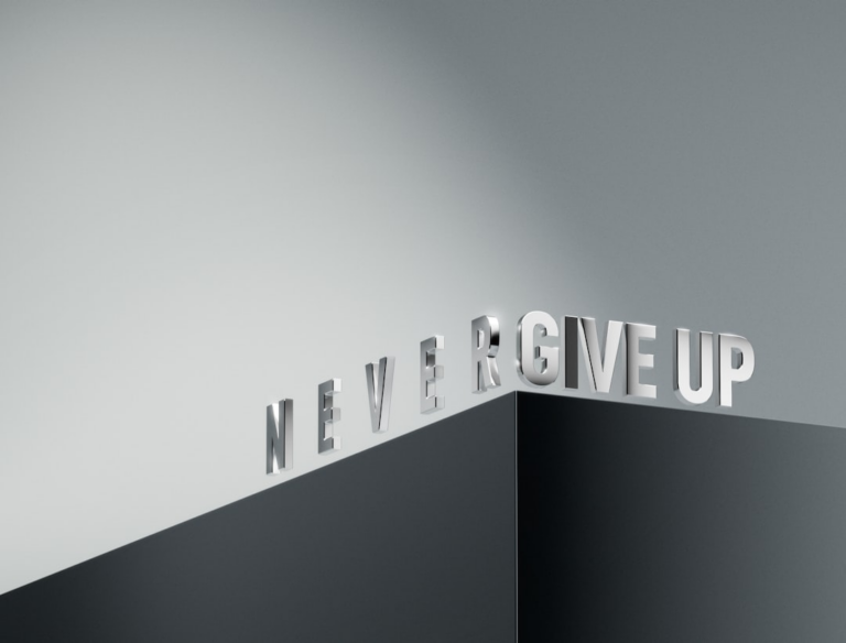 a black and white photo of the word never give up — Foto por Milad Fakurian na Unsplash